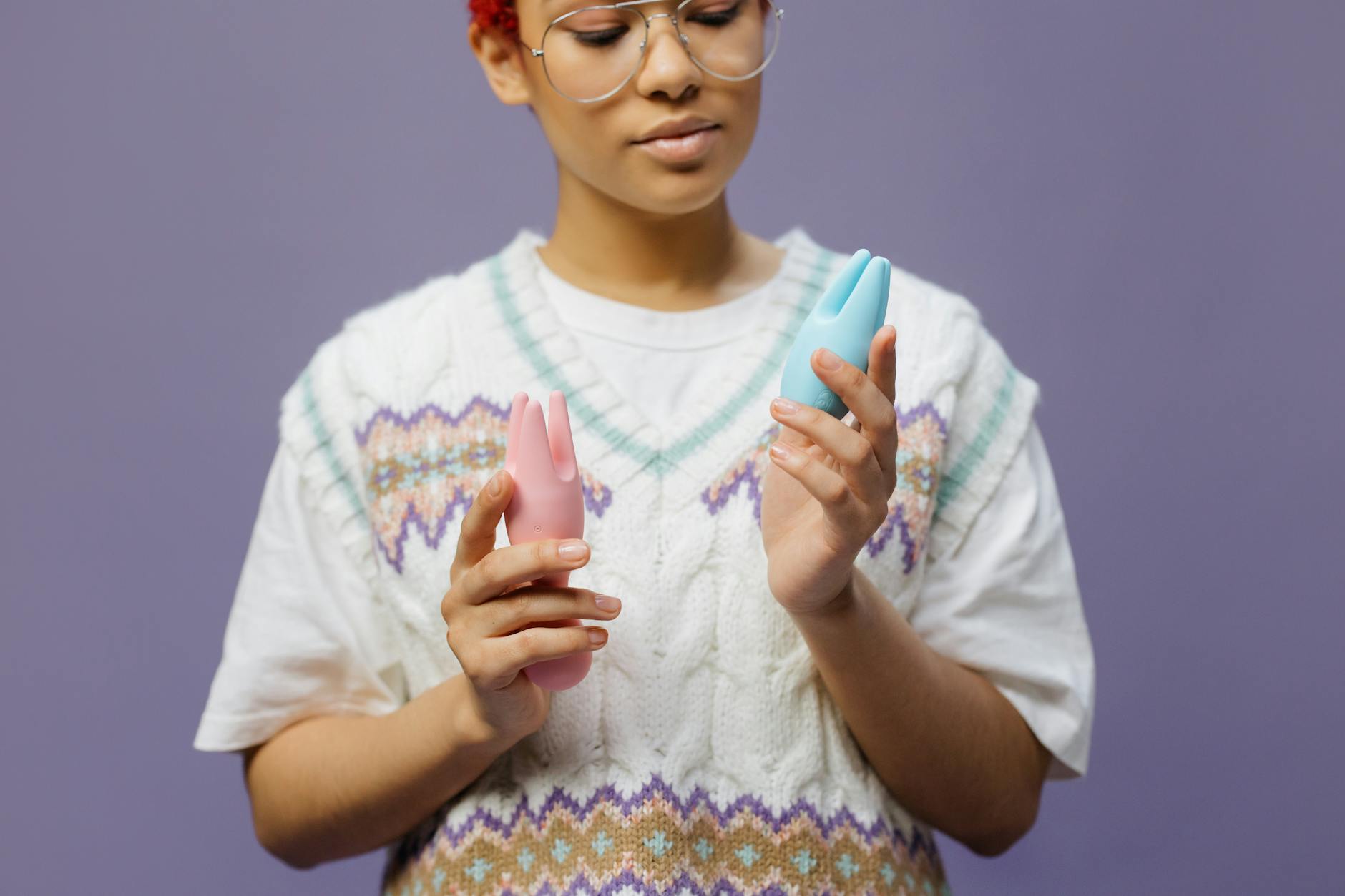 Woman holding lemon vibrators in contemplative moment, symbolizing personal pleasure and self-discovery